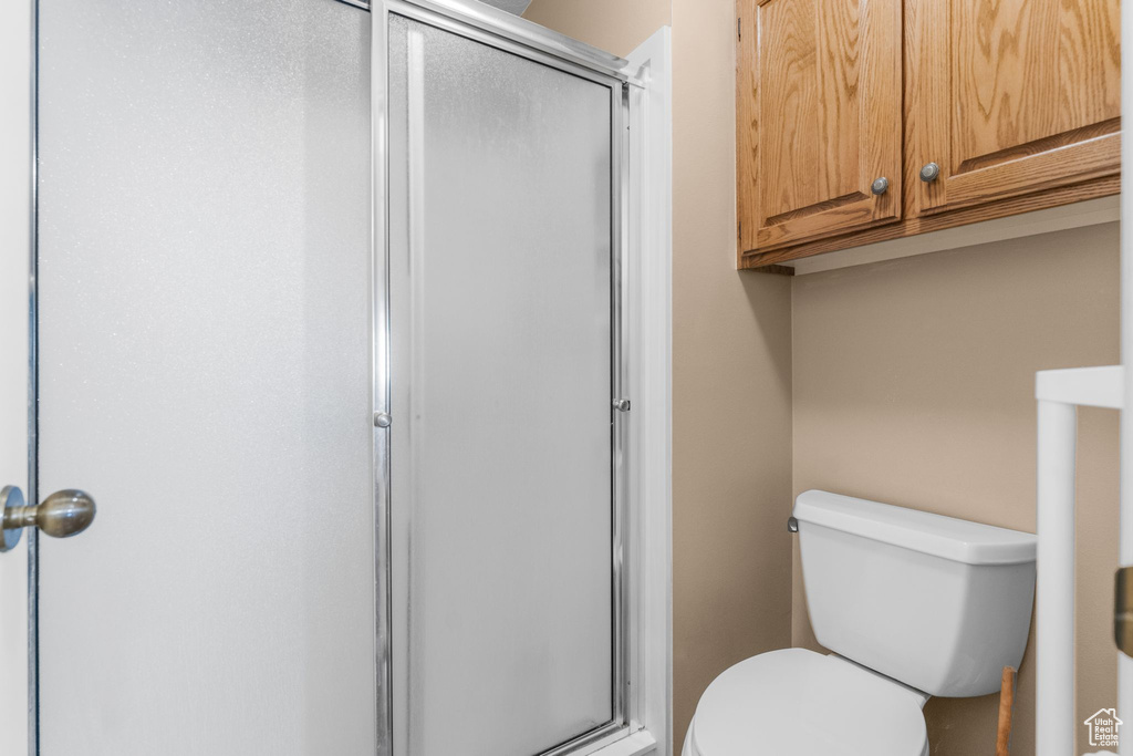 Full bathroom featuring a stall shower