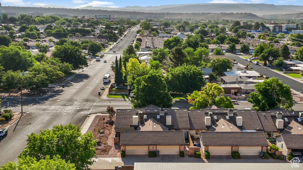 Aerial perspective of suburban area featuring a mountain backdrop
