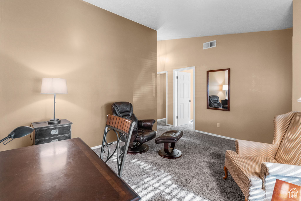 Carpeted home office with baseboards