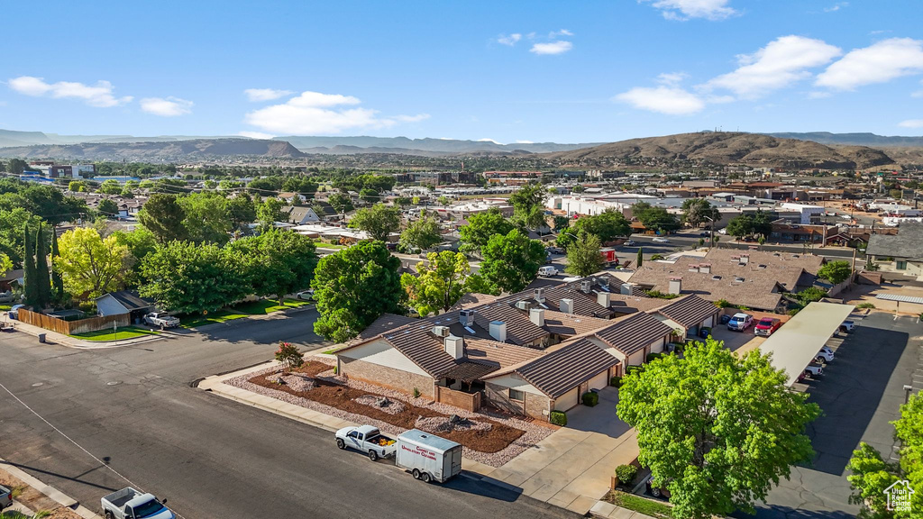Aerial perspective of suburban area featuring a mountain backdrop