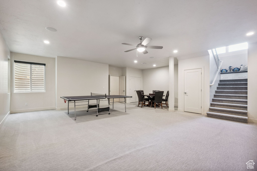 Recreation room with carpet floors, a ceiling fan, and recessed lighting