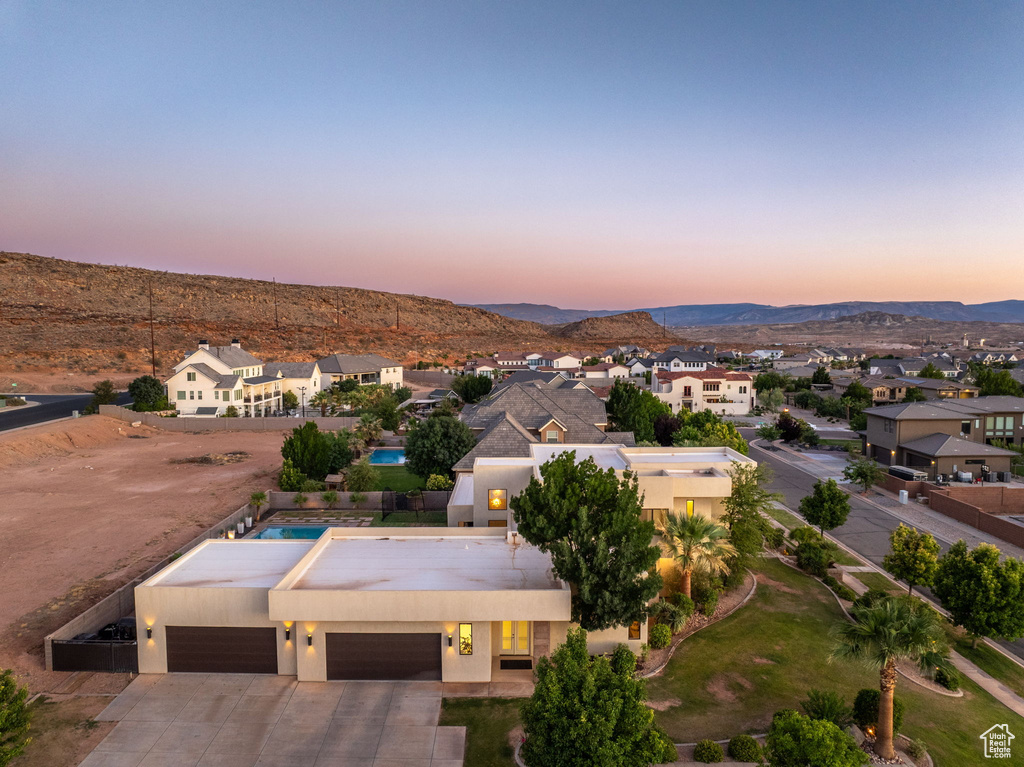 Aerial view at dusk of a residential view and a mountain view