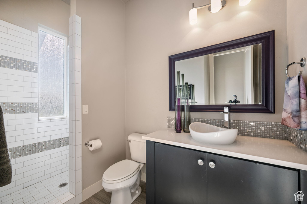 Bathroom with a tile shower and vanity