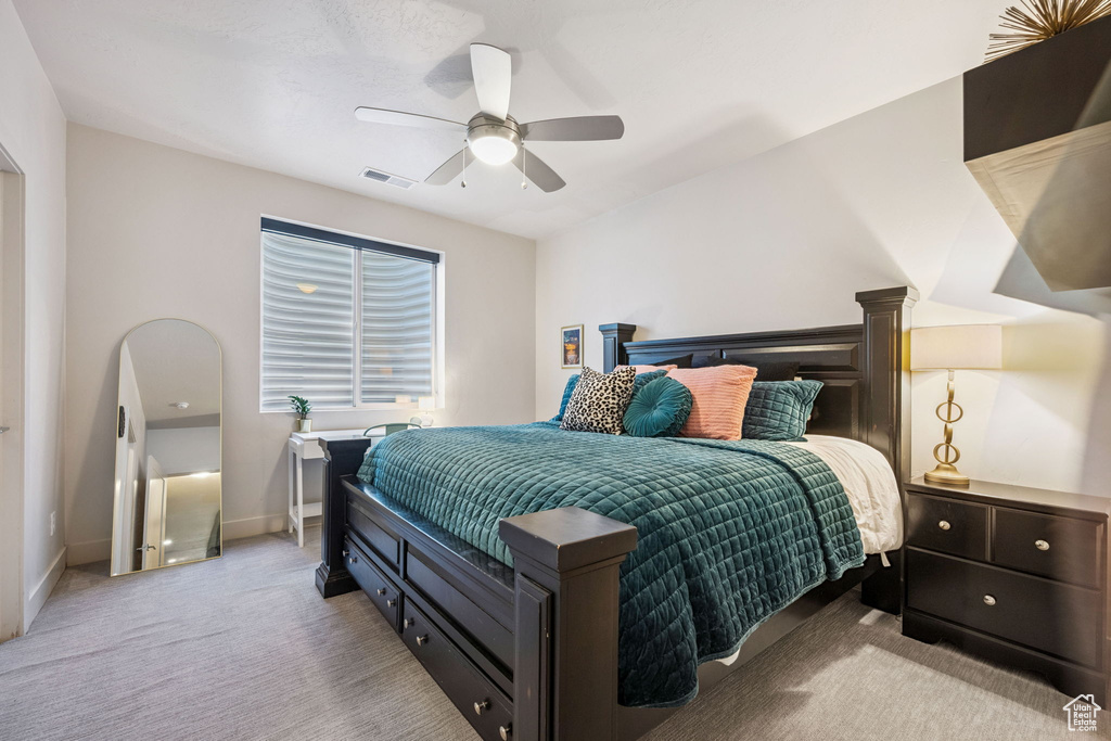 Bedroom featuring carpet flooring and a ceiling fan