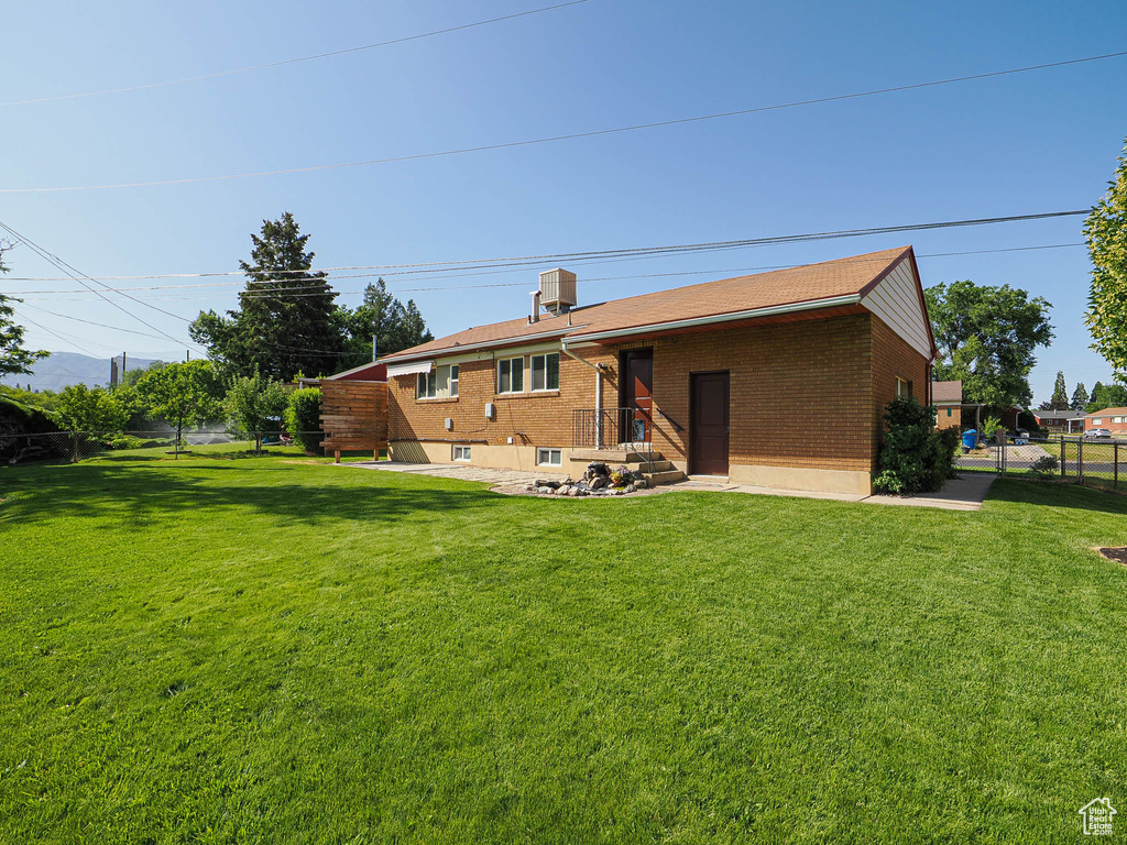 Back of property with brick siding