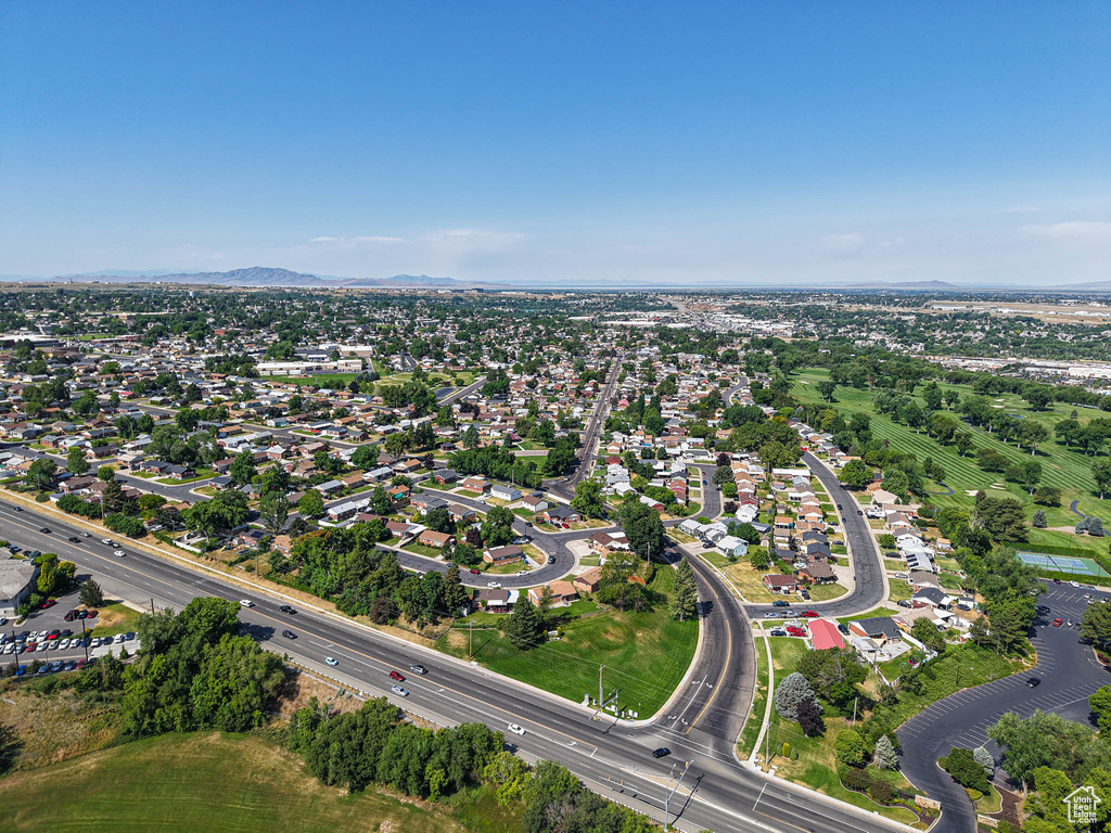Aerial overview of property\'s location with a mountainous background