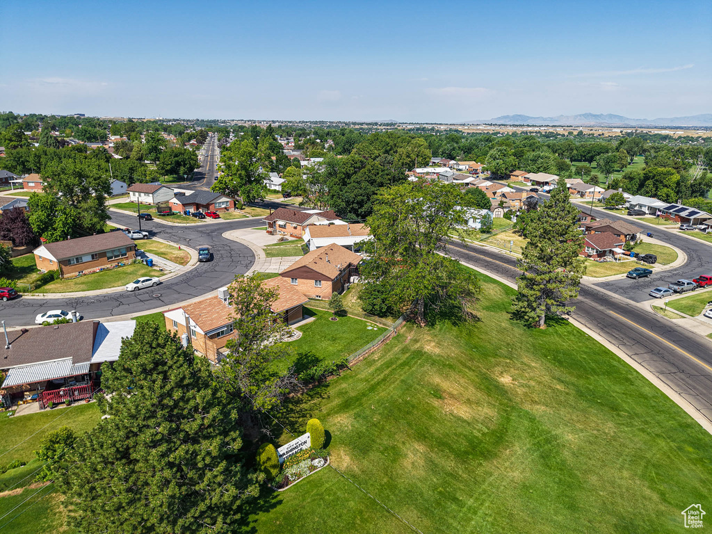 Aerial view of residential area featuring a mountainous background