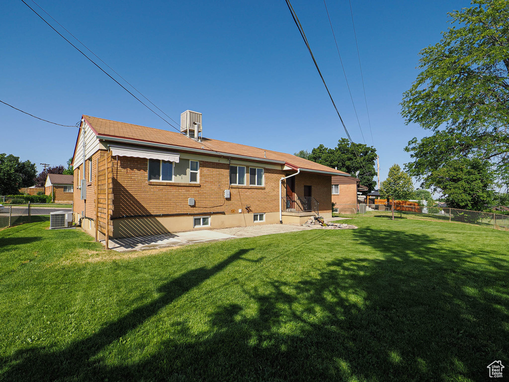 Rear view of house with brick siding