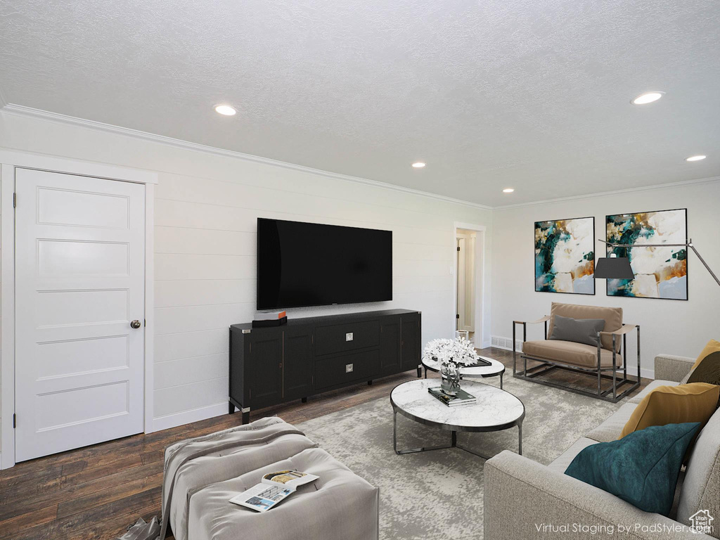 Living room with ornamental molding, wood finished floors, recessed lighting, and a textured ceiling