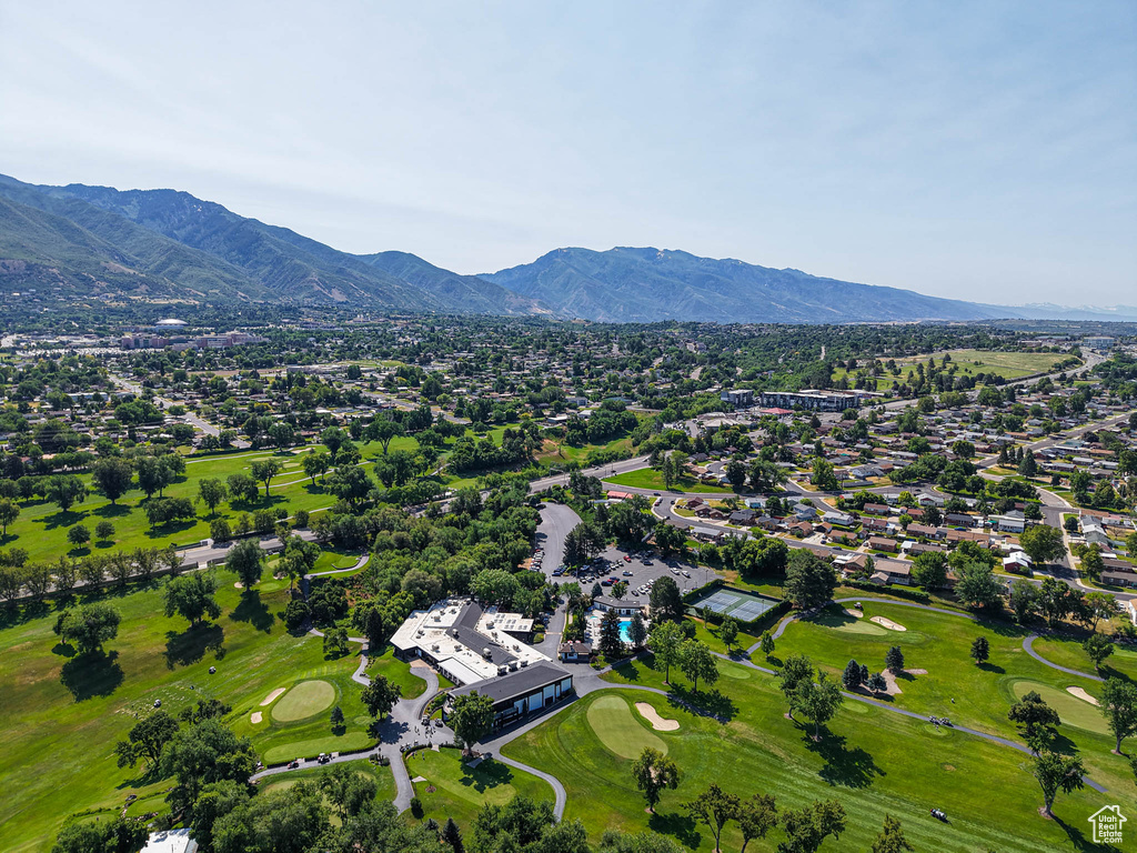 Drone / aerial view of mountains and a local golf course