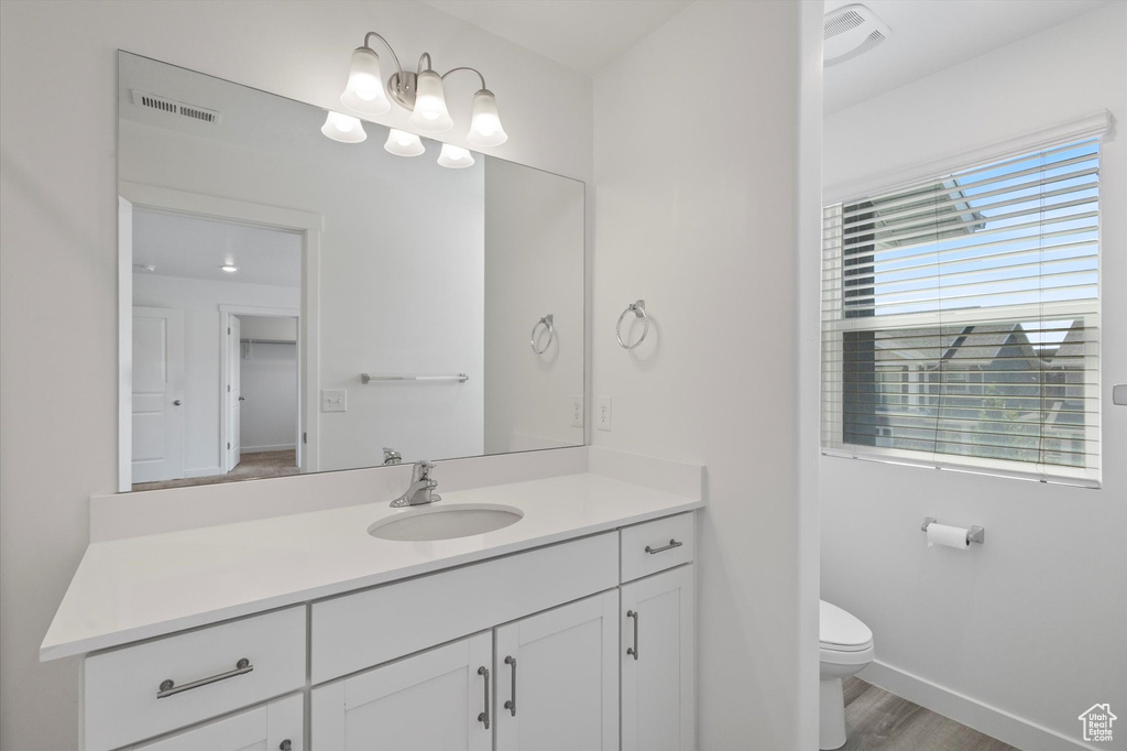 Bathroom with vanity and wood finished floors