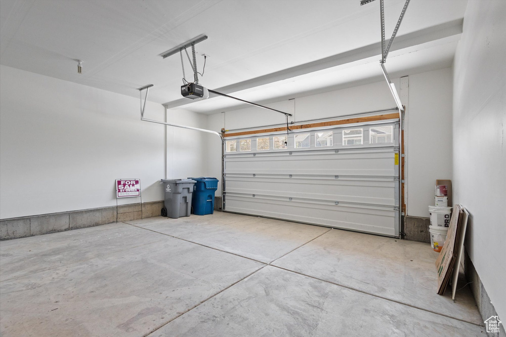 Garage featuring a garage door opener