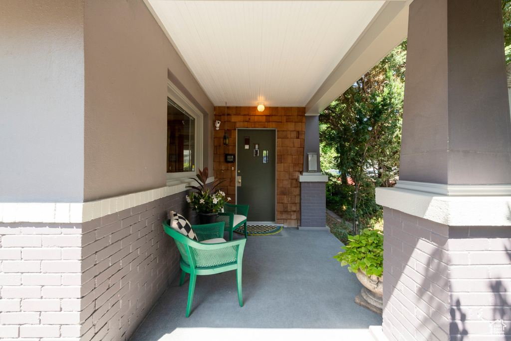 View of exterior entry with covered porch