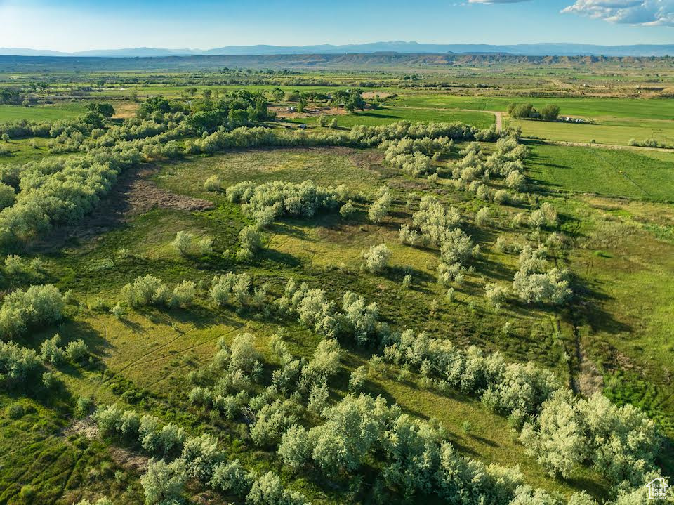 Overview of rural landscape featuring a mountainous background