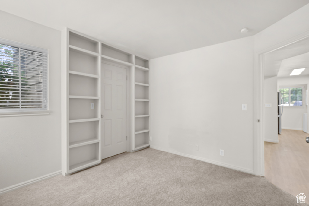 Unfurnished bedroom with carpet floors