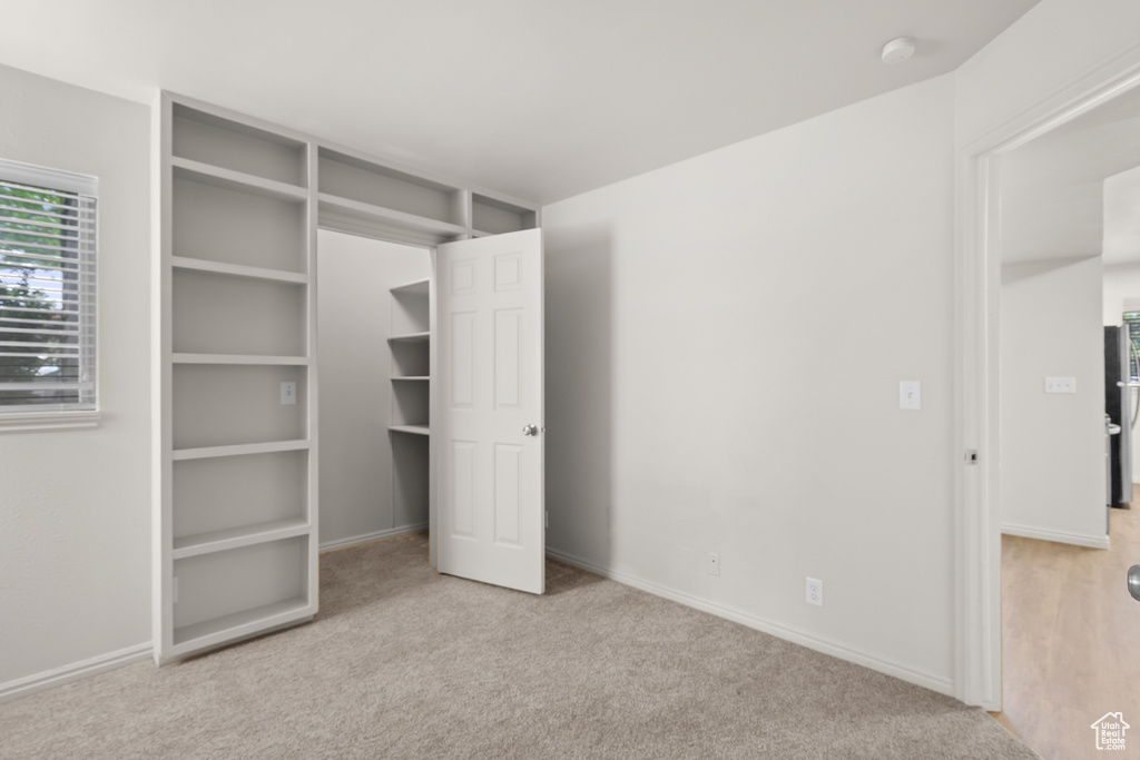 Unfurnished bedroom with carpet