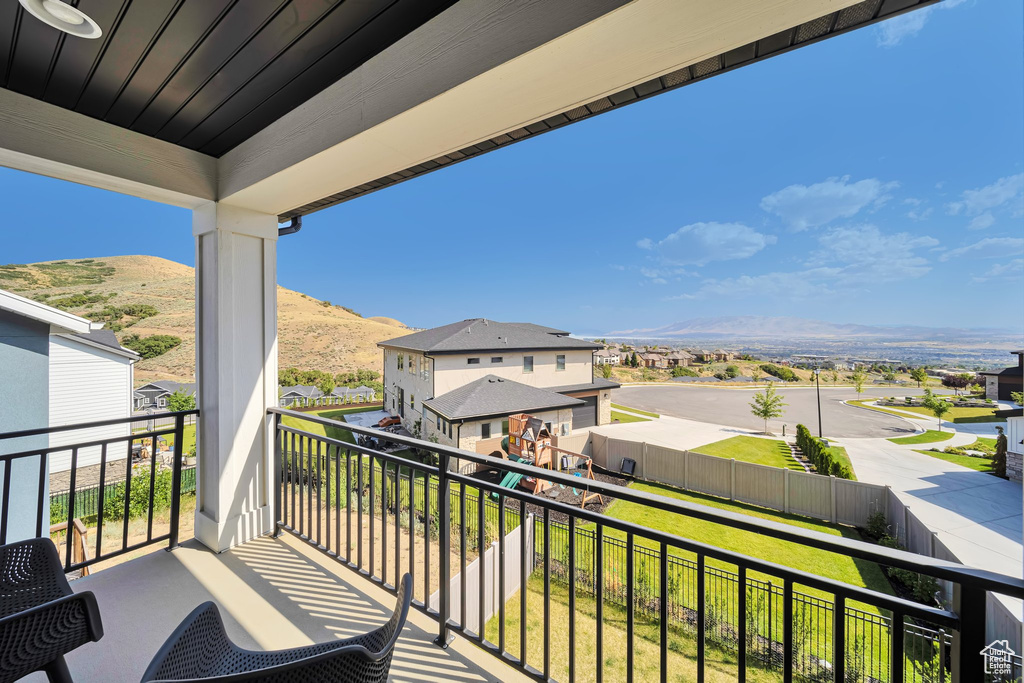 Balcony with a mountain view and a residential view
