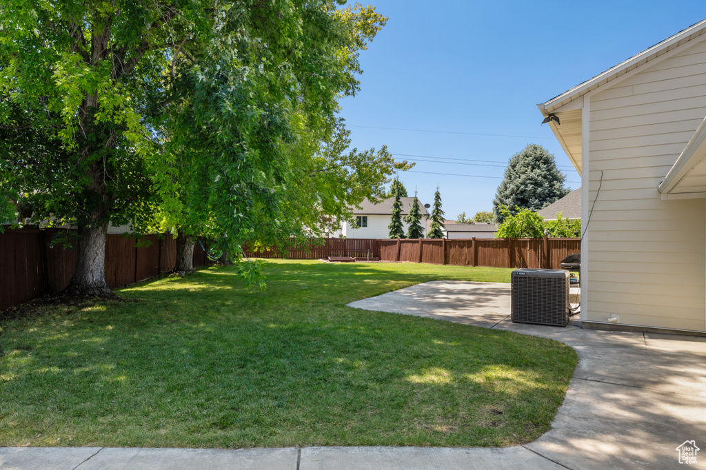 Fenced backyard with a patio