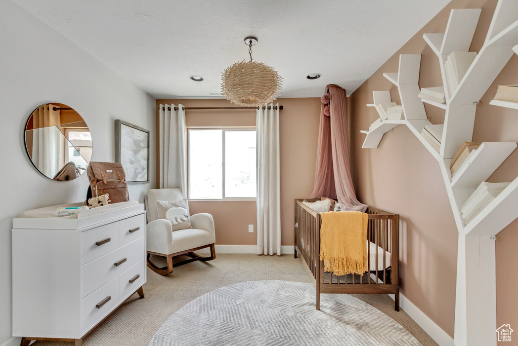 Sitting room with light carpet and baseboards