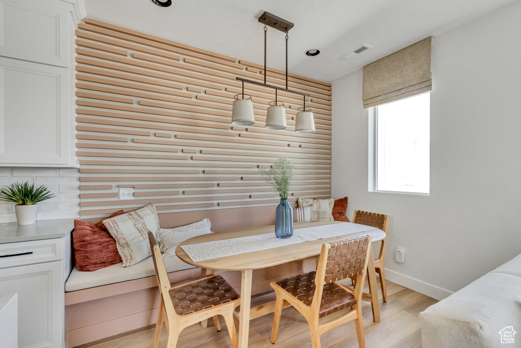 Dining space featuring light wood-style flooring and breakfast area