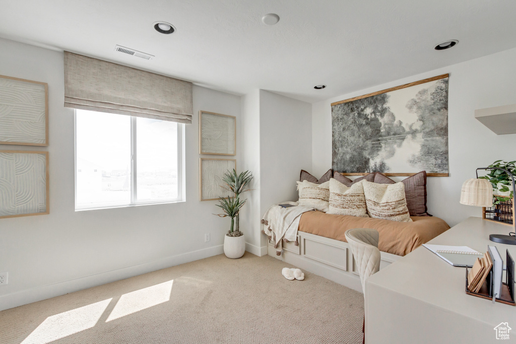 Carpeted bedroom with recessed lighting and baseboards