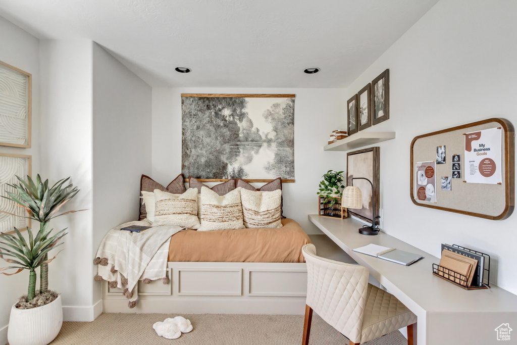 Carpeted bedroom with recessed lighting