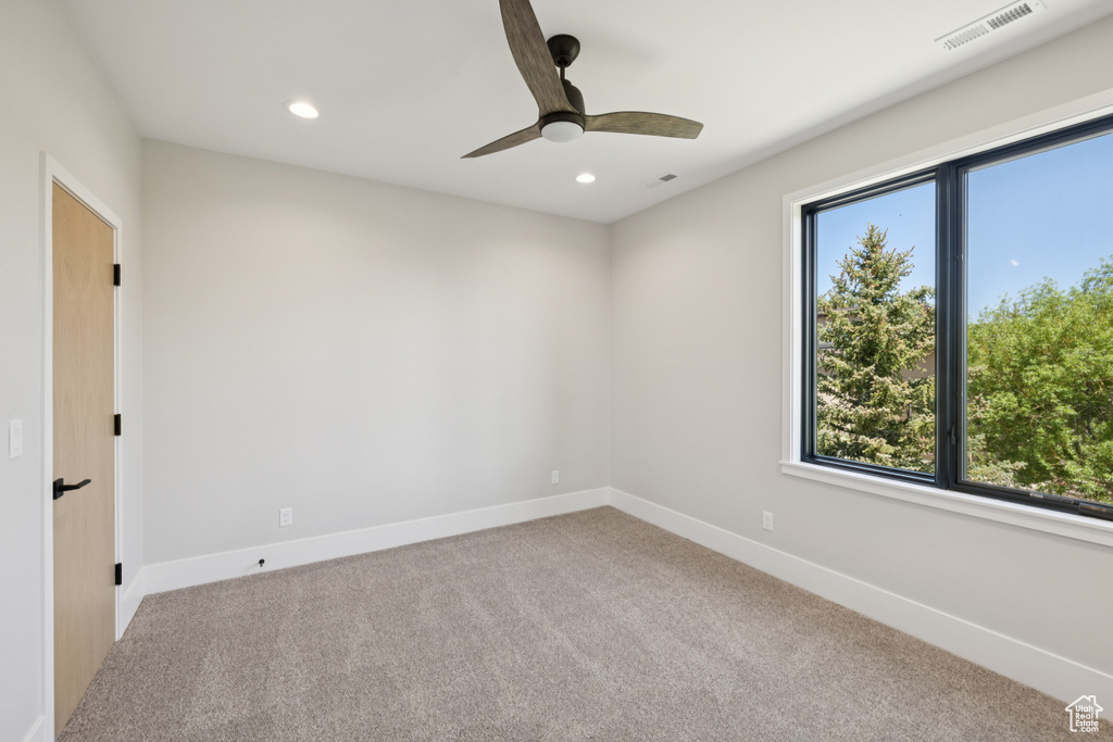 Unfurnished room featuring carpet floors, recessed lighting, and a ceiling fan