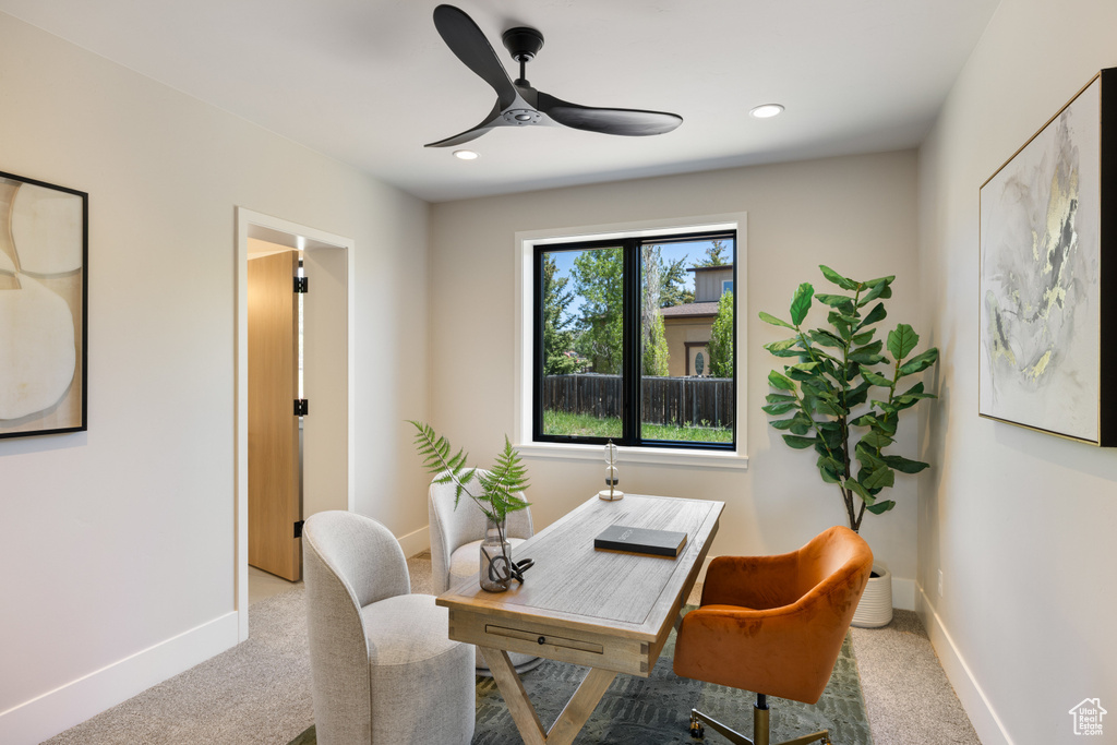 Office space with a ceiling fan, carpet flooring, and recessed lighting