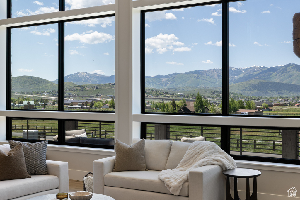 Sunroom / solarium with a mountain view