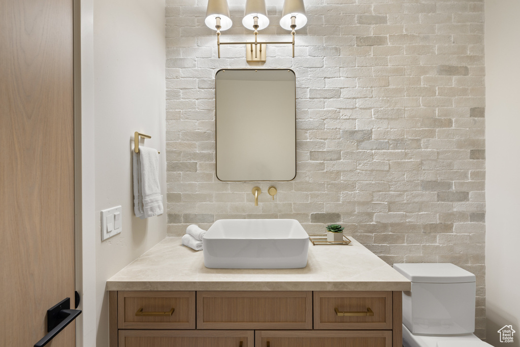 Bathroom with vanity and toilet