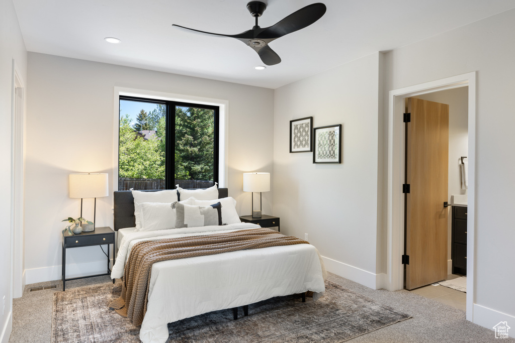 Bedroom featuring light carpet, a ceiling fan, recessed lighting, and connected bathroom