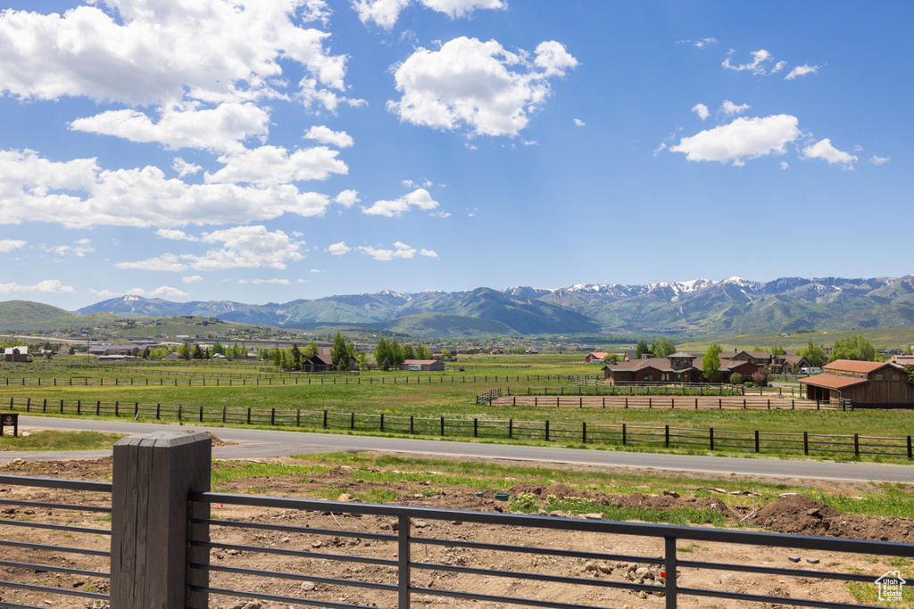 View of mountain backdrop with rural landscape