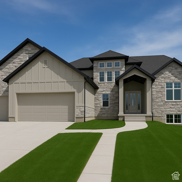 View of front of house with stone siding, board and batten siding, a garage, a front yard, and driveway