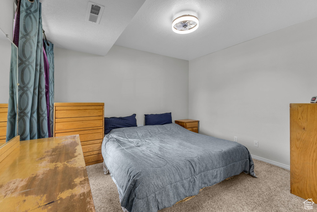 Bedroom featuring carpet flooring