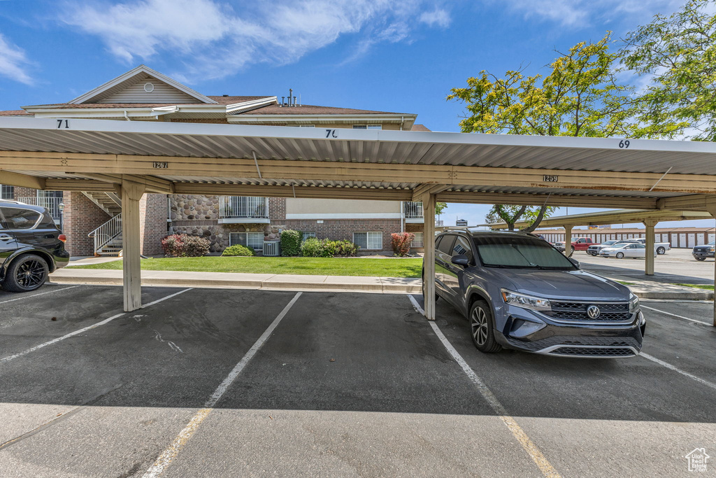 Covered parking lot featuring stairway