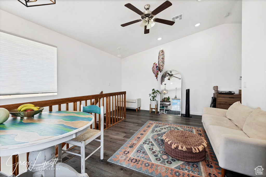 Living area featuring lofted ceiling, wood finished floors, ceiling fan, and recessed lighting