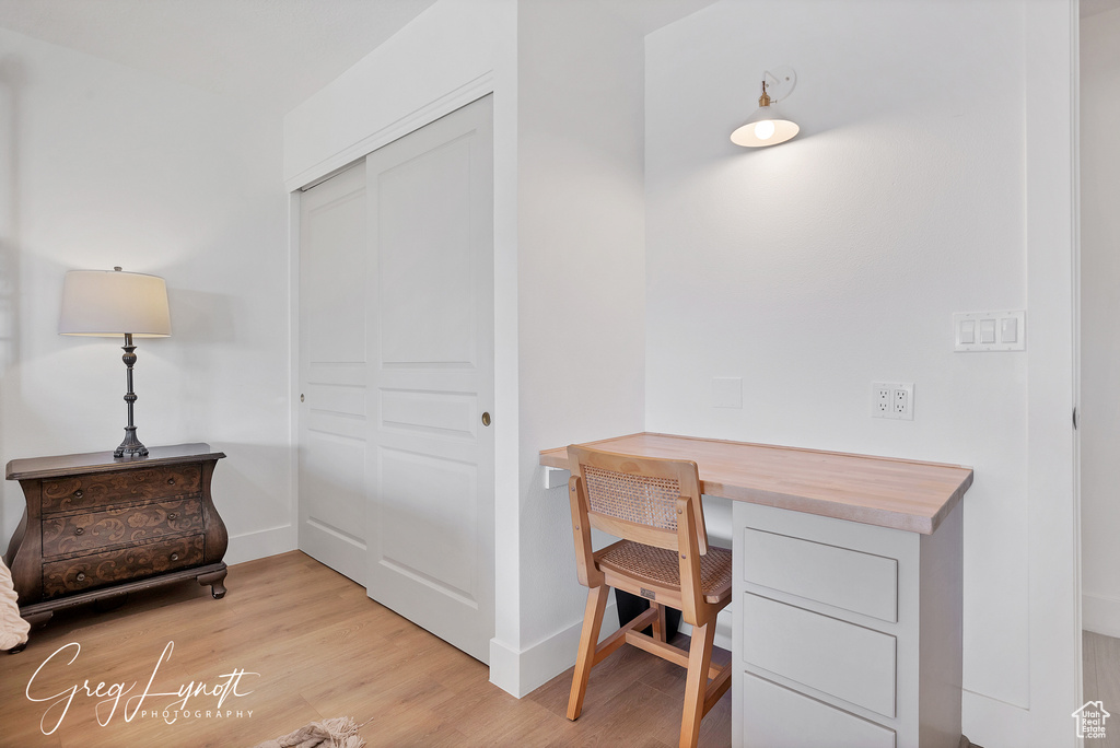 Office space featuring light wood-type flooring