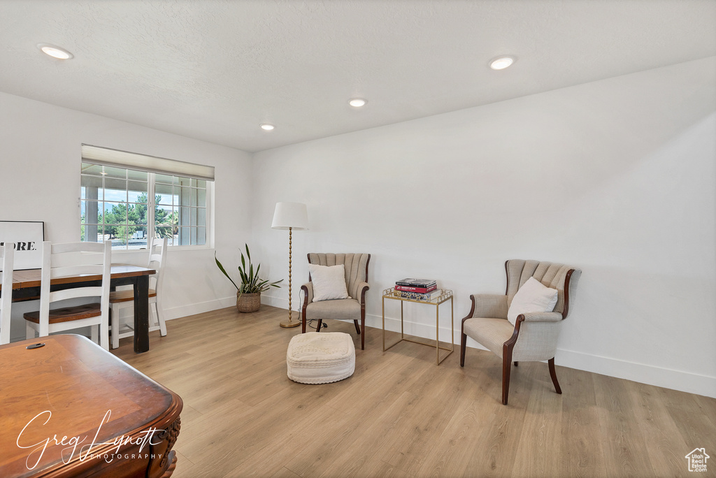 Sitting room featuring wood finished floors and recessed lighting