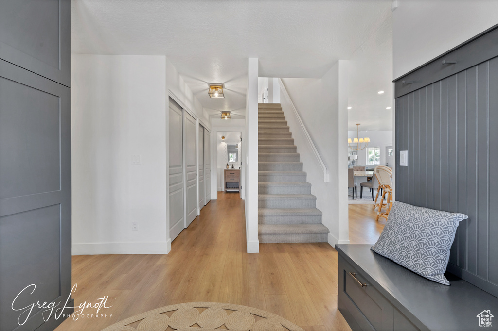 Entrance foyer featuring light wood finished floors and stairs