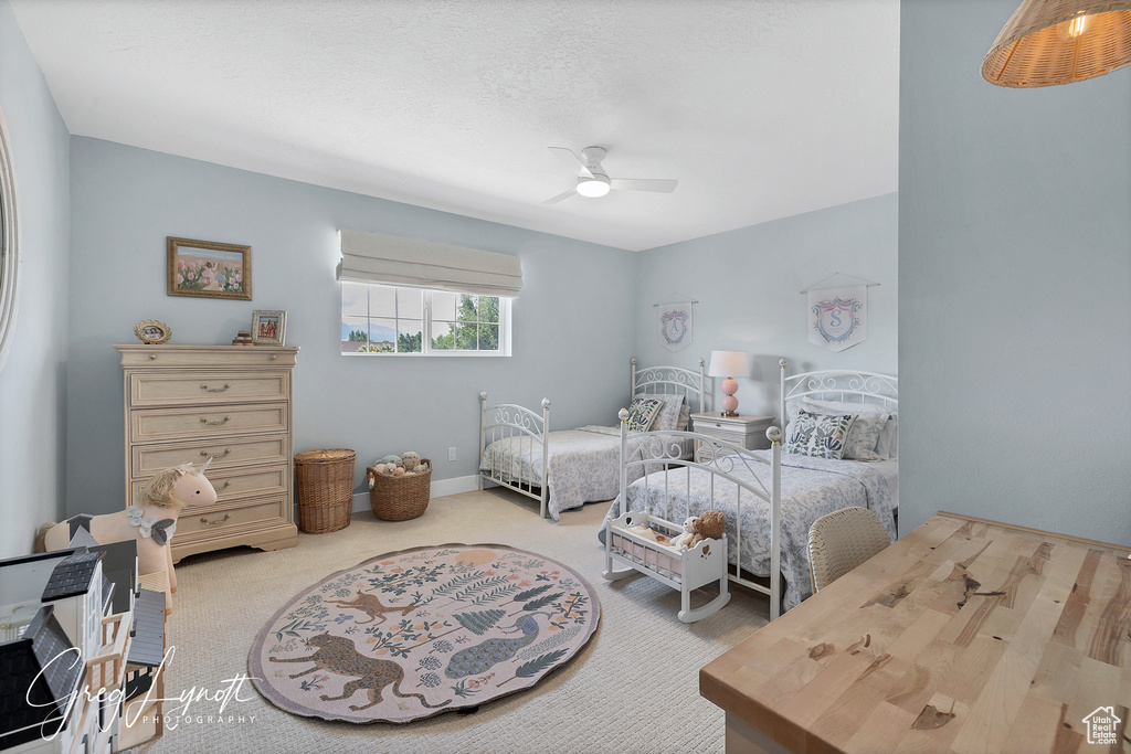 Bedroom with carpet and ceiling fan