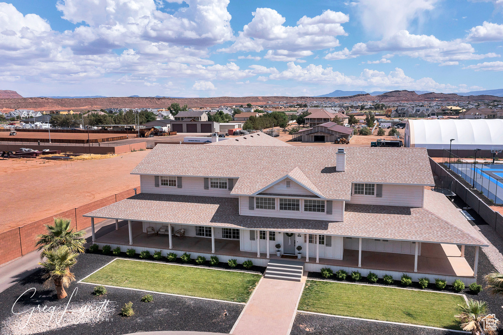 Aerial view of residential area featuring a mountain backdrop