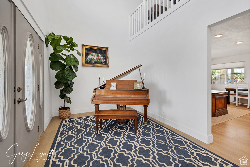 Foyer featuring wood finished floors and recessed lighting