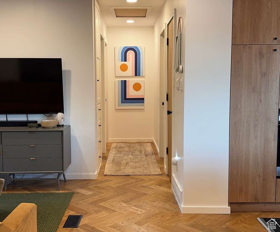 Hallway featuring baseboards and recessed lighting