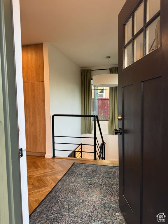 Hallway with an upstairs landing and baseboards