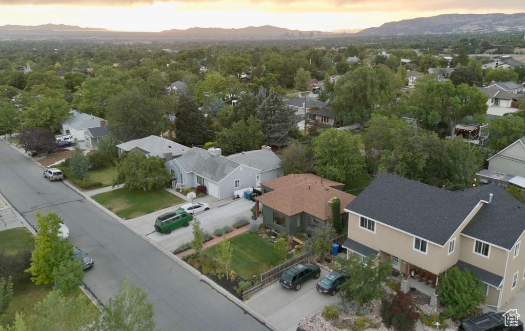 Aerial perspective of suburban area with a mountainous background