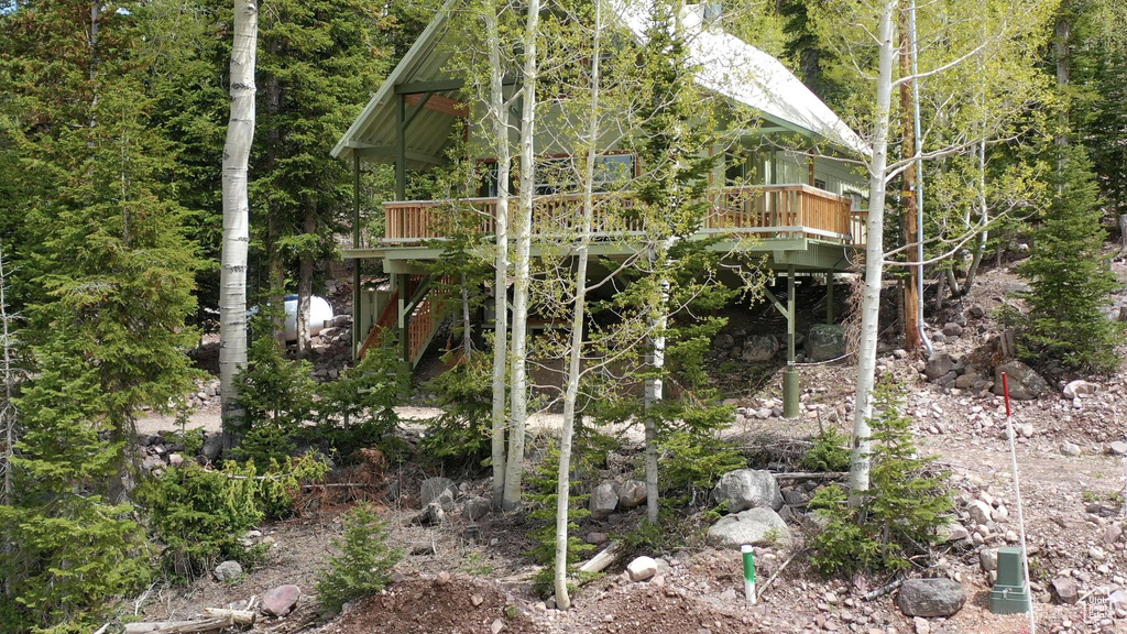 View of outbuilding with a wooded view