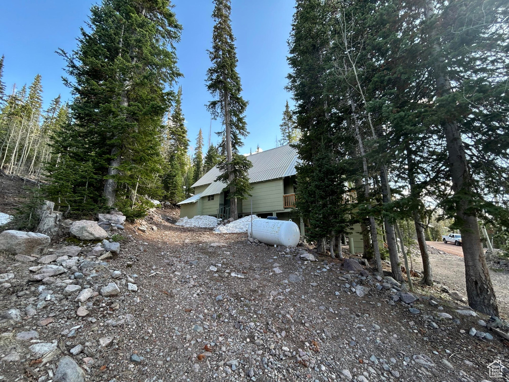View of side of home with a metal roof