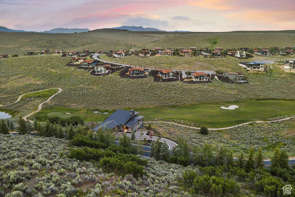 Aerial view of property's location featuring nearby suburban area