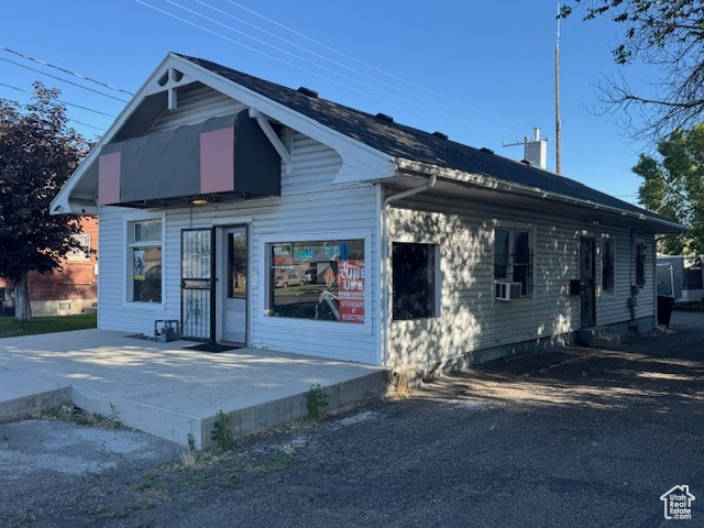 View of front of house featuring cooling unit