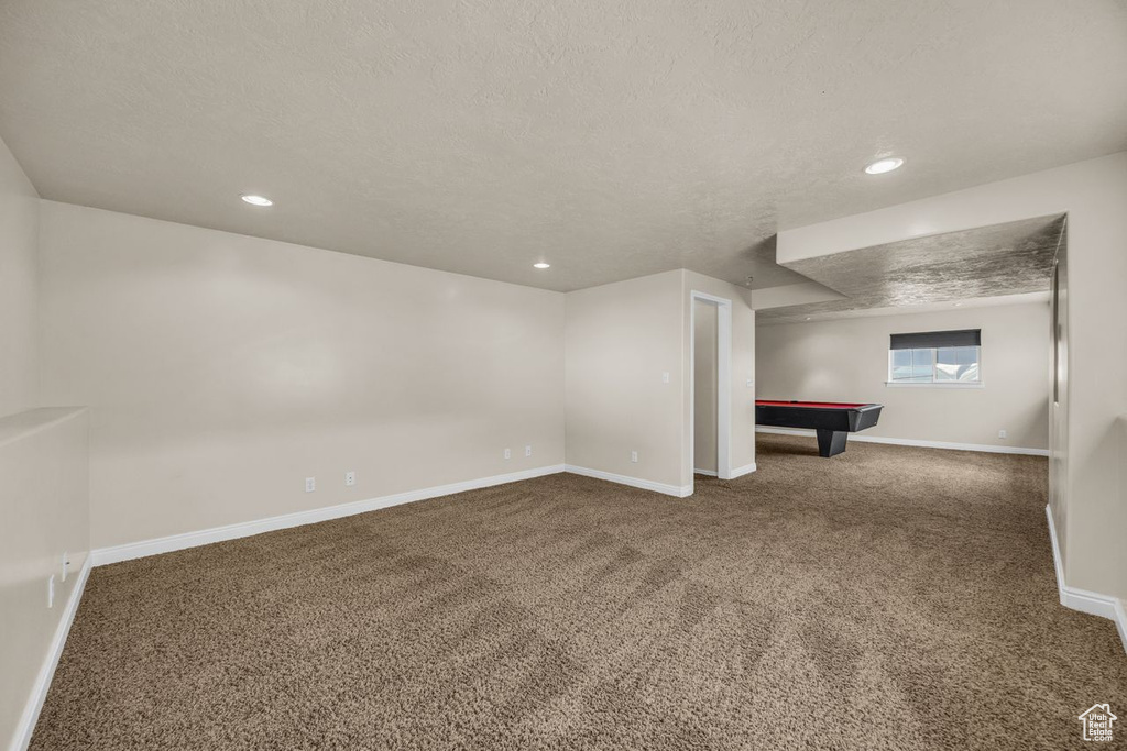 Basement with carpet, billiards table, a textured ceiling, and recessed lighting
